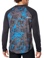 Dakine Dropout long sleeve jersey in cyan scribble pattern on model from behind