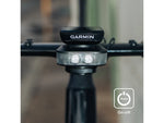 Ravemen FR1100 front light on handlebar with Garmin device on top and auto on-off icon overlay