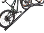Yakima RampUp bike loading ramp system with mountain bikes on white background