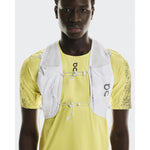 On Ultra Vest Pro Unisex in white worn over yellow On running shirt by male model