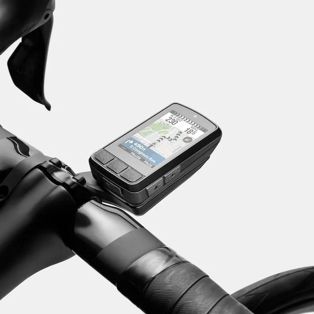 Black Wahoo ELEMNT BOLT GPS bike computer mounted on bicycle handlebars