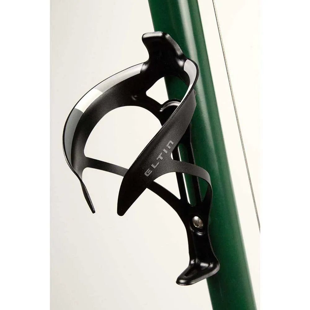 Black Eltin bottle cage mounted on green bicycle frame against white background