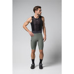 Male cyclist wearing Gobik Grit 2.0 bib shorts in evergreen with black mesh top