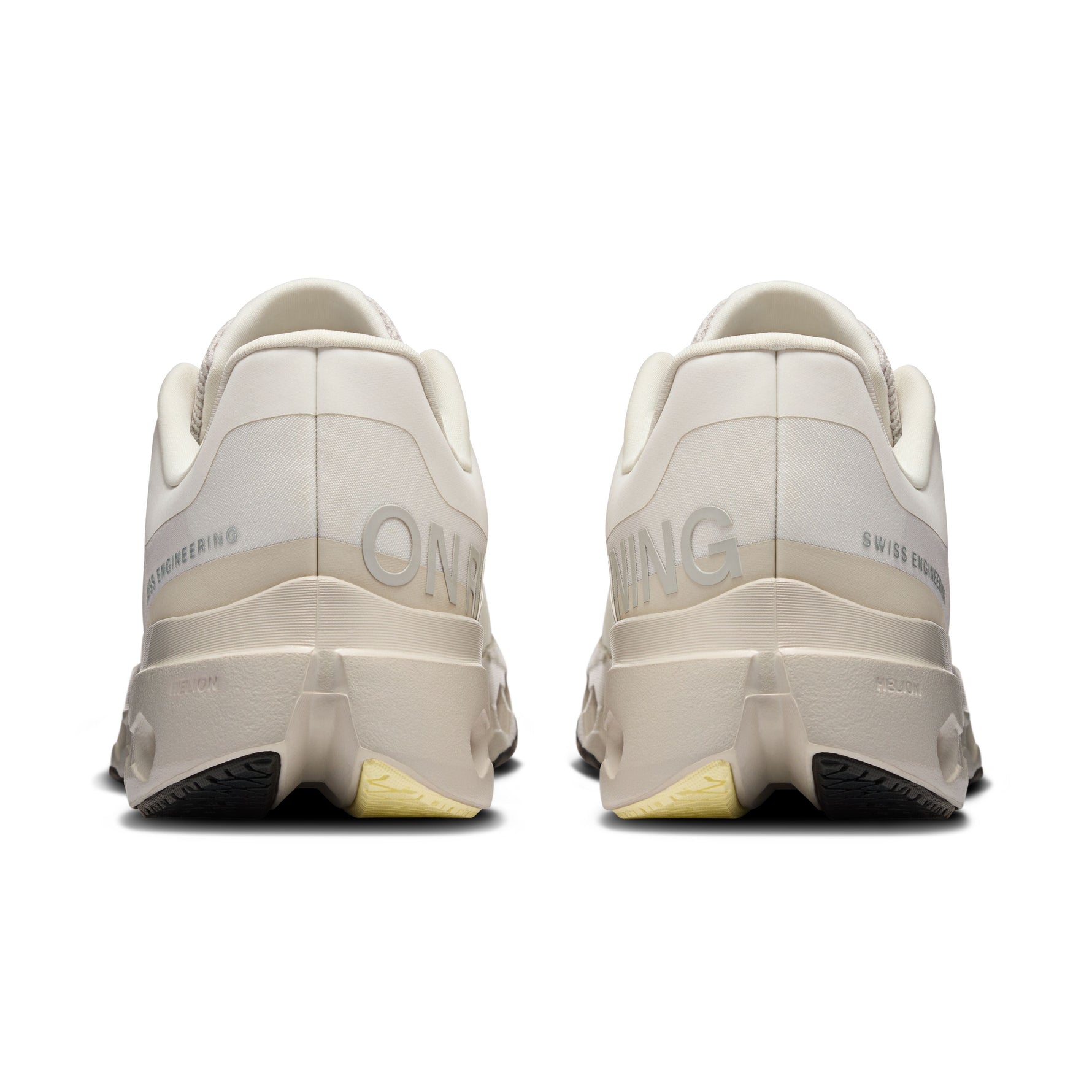 On Cloudsurfer Next running shoes in ivory and silver colorway, rear view