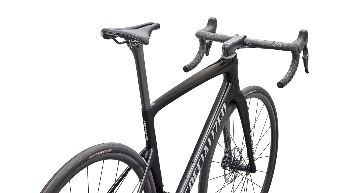 Close-up detail of Specialized Tarmac SL9 Comp saddle, seatpost, and cockpit in charcoal metallic