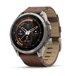 Garmin Fenix 9 Pro smartwatch with titanium case and walnut leather band, analog watch face display
