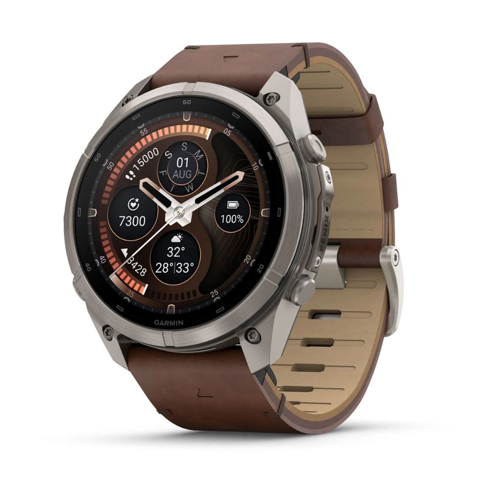 Garmin Fenix 9 Pro smartwatch with titanium case and walnut leather band, analog watch face display