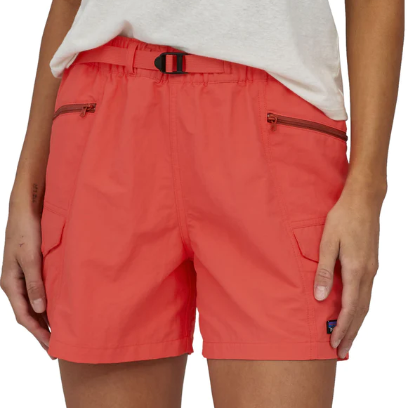 Woman wearing coral Patagonia outdoor shorts with belt and zippered pockets