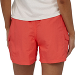 Woman wearing coral red Patagonia outdoor shorts with cargo pockets