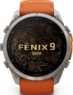 Garmin Fenix 9 Pro smartwatch front view with titanium case and orange band showing topographic display