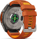 Garmin Fenix 9 Pro back view showing titanium case, heart rate sensor, and orange silicone band