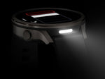 Garmin Venu 4 smartwatch in slate gray with black silicone band showing illuminated display