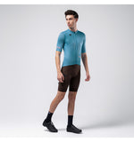 Man wearing Gobik Stark short sleeve cycling jersey in light blue with black shorts