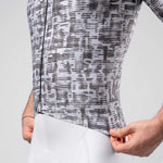 Grey patterned cycling jersey with abstract dot design on model