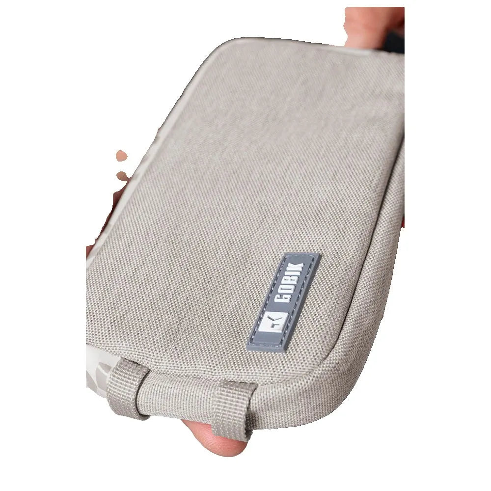 Gobik Essential phone case in light gray being held in hands