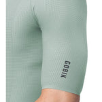 Gobik Phantom Jersey in sage green showing textured fabric detail and logo