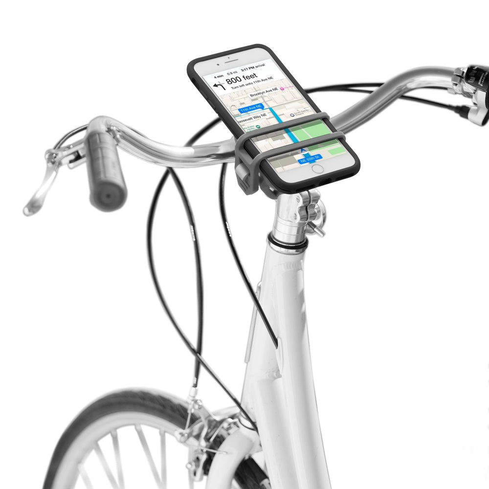 Nite Ize HandleBand smartphone bar mount securing iPhone to bicycle handlebar with navigation app displayed.