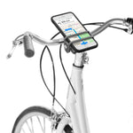 Nite Ize HandleBand Universal Smartphone Bar Mount in grey mounted on white bicycle handlebars