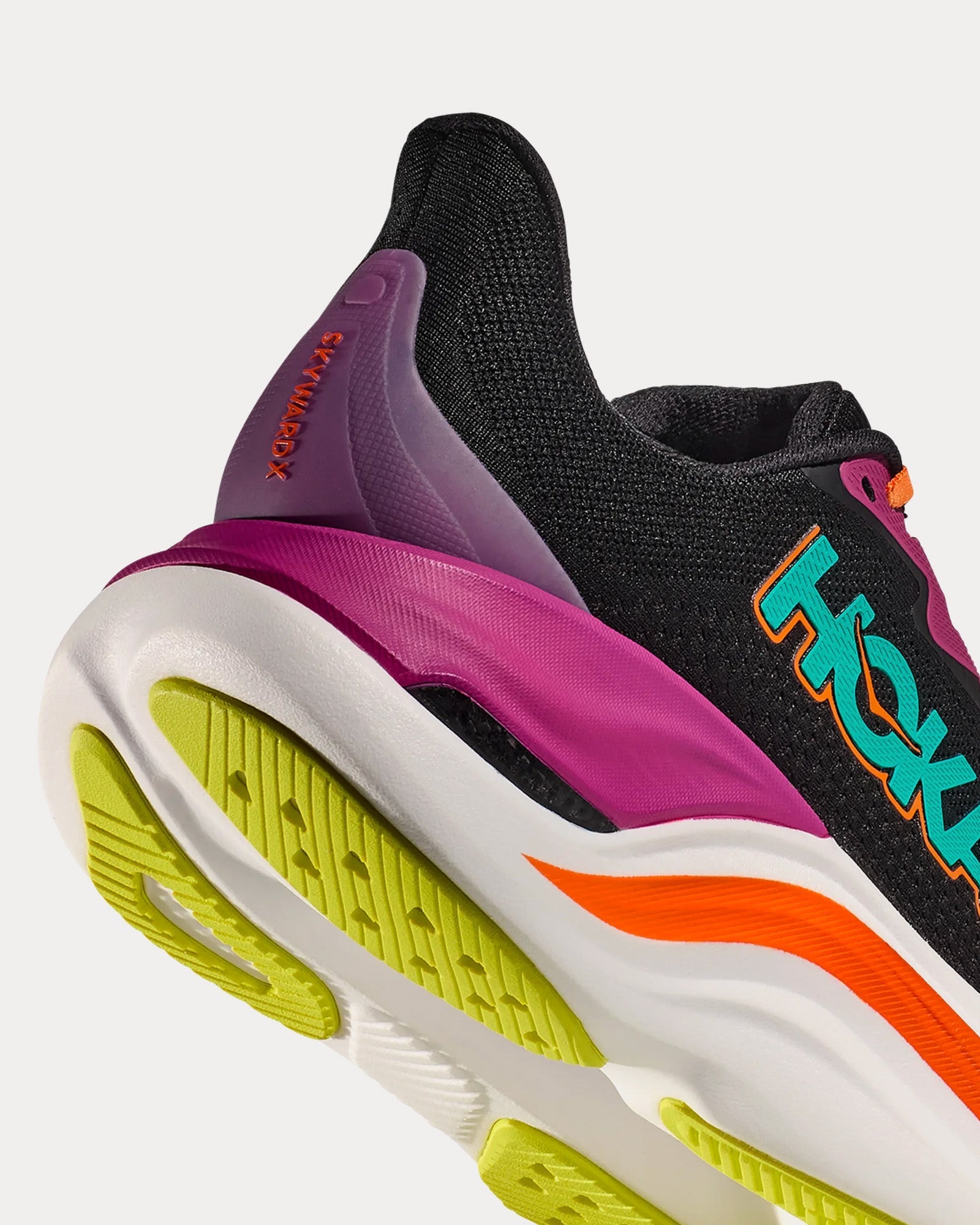 Hoka Skyward X women's running shoe in black with electric aqua accents