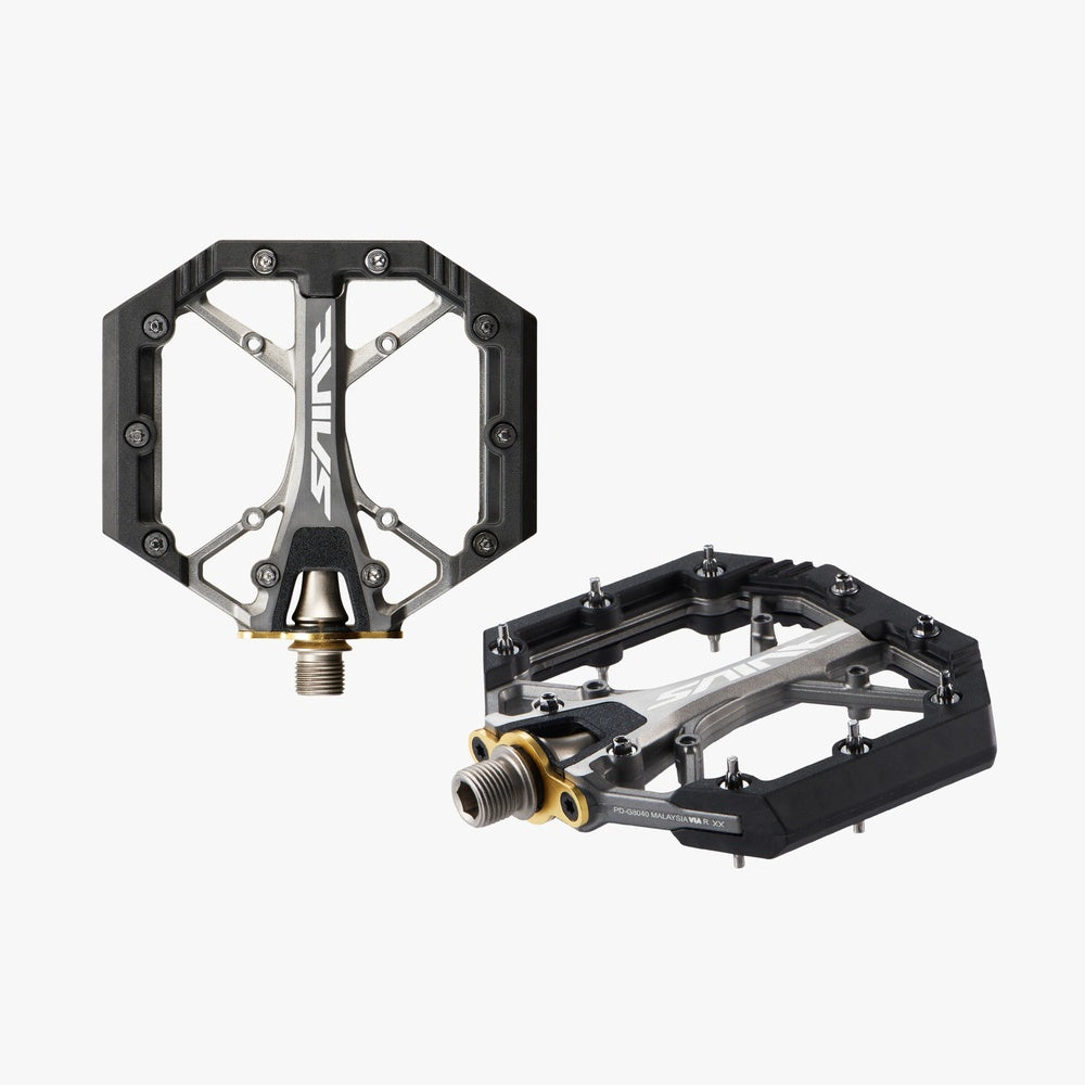 Shimano Saint PD-G8040 flat MTB pedals shown from front and side angles on white background