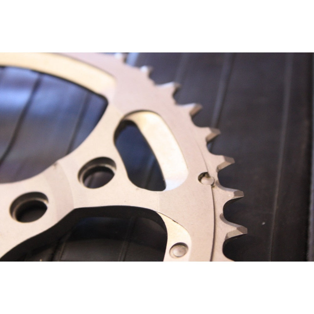 Shimano XTR silver chainring showing teeth and mounting holes in close-up detail