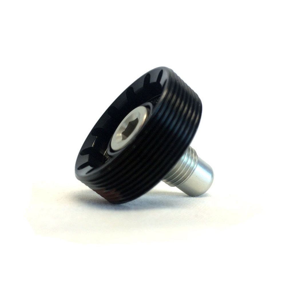 Black axle cap and bolt component with threaded metal shaft on white background