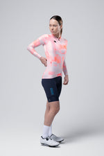 Woman wearing Gobik Vanquish long sleeve cycling jersey in pink flamingo pattern