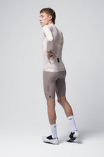 Gobik Vanquish long sleeve cycling jersey in whisper beige color worn by model