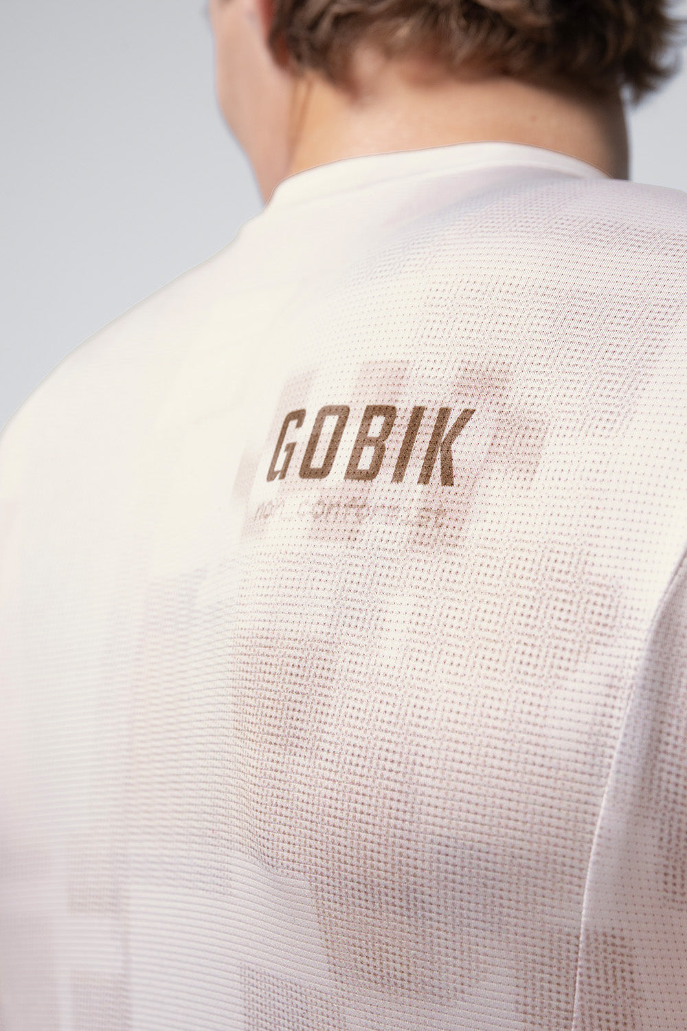 Back view of GOBIK Vanquish long sleeve cycling jersey in whisper cream color