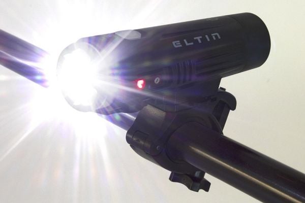 ELTIN Pro 850 lumen black bike light mounted on handlebar with bright LED beam