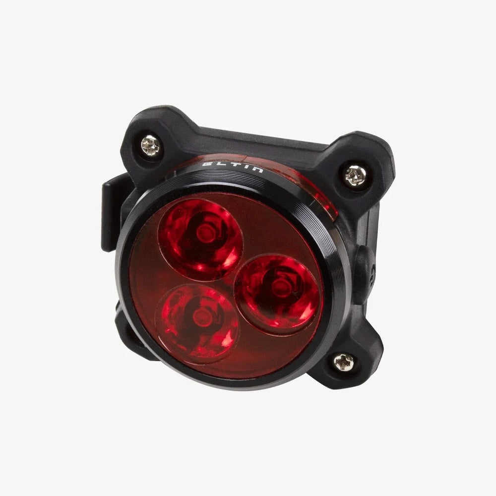Eltin rear bike light with black housing and three red LED lights illuminated