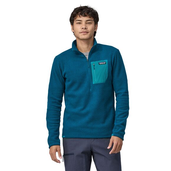 Man wearing Patagonia R1 Air Zip-Neck fleece in teal blue color