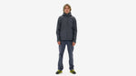 Man wearing Patagonia Torrentshell 3L Jacket in Smolder Blue with matching pants