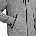 Grey heather zip-up hoodie with black zipper and side pockets on model
