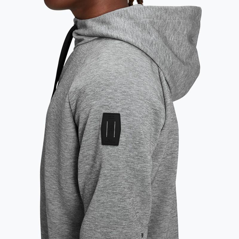 Man wearing grey On zipped hoodie with hood up against white background