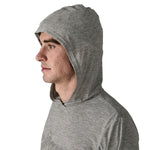 Man wearing grey heather Patagonia hooded pullover, side profile view on white background