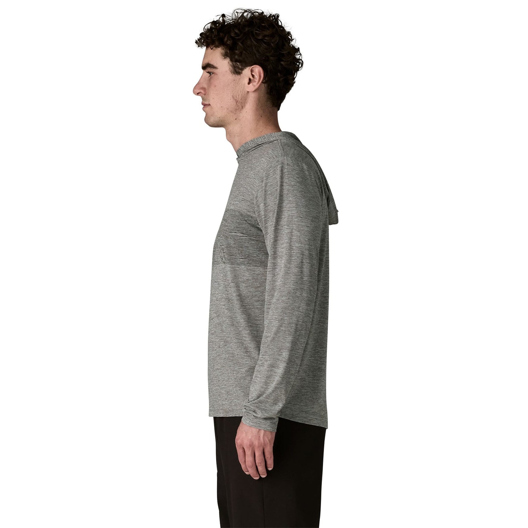 Man wearing grey Patagonia hoody with striped panel, side view on white background