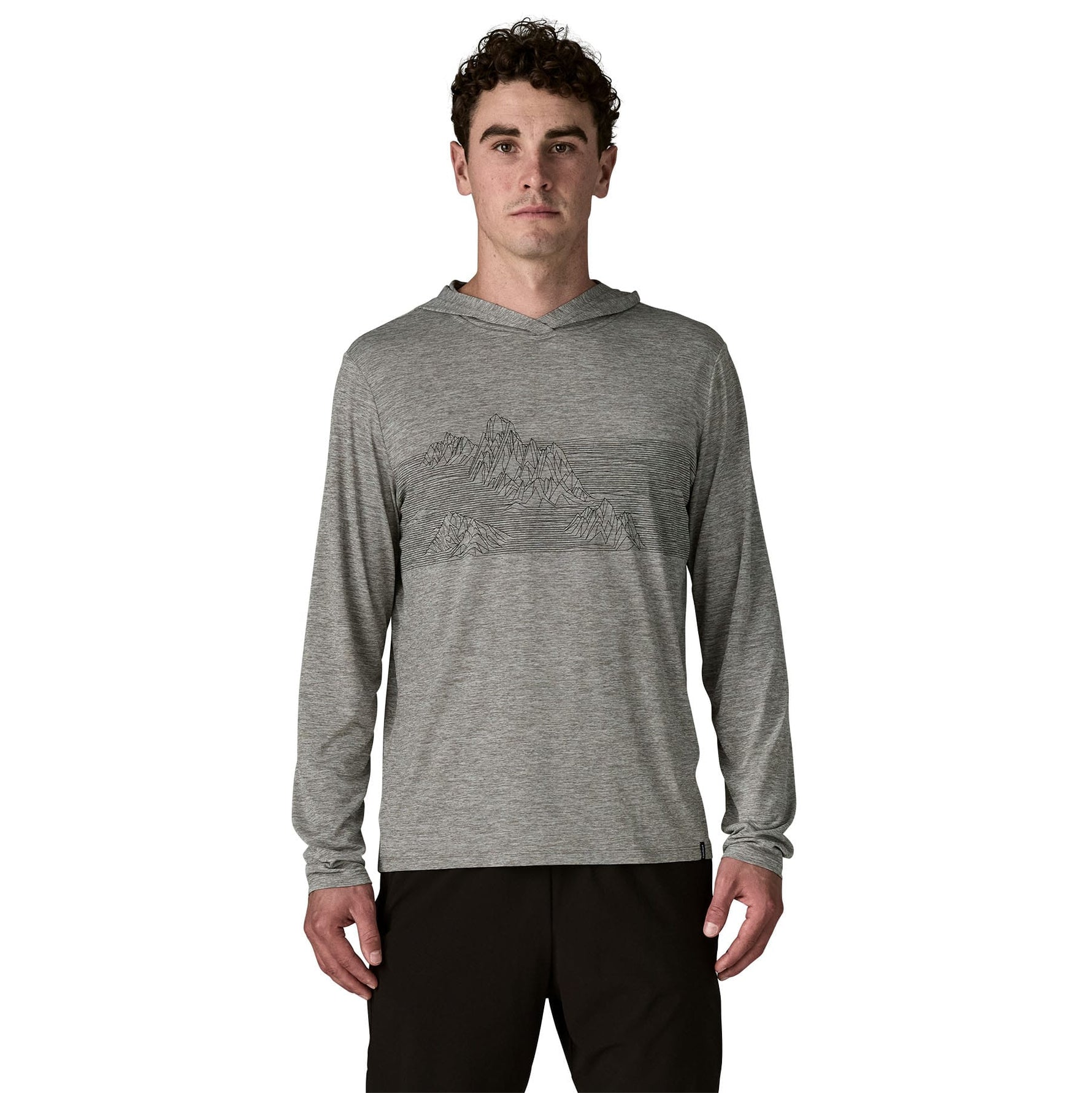 Man wearing grey Patagonia hooded long sleeve shirt with geometric mountain design