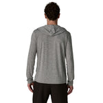 Back view of man wearing Patagonia grey hooded long sleeve shirt