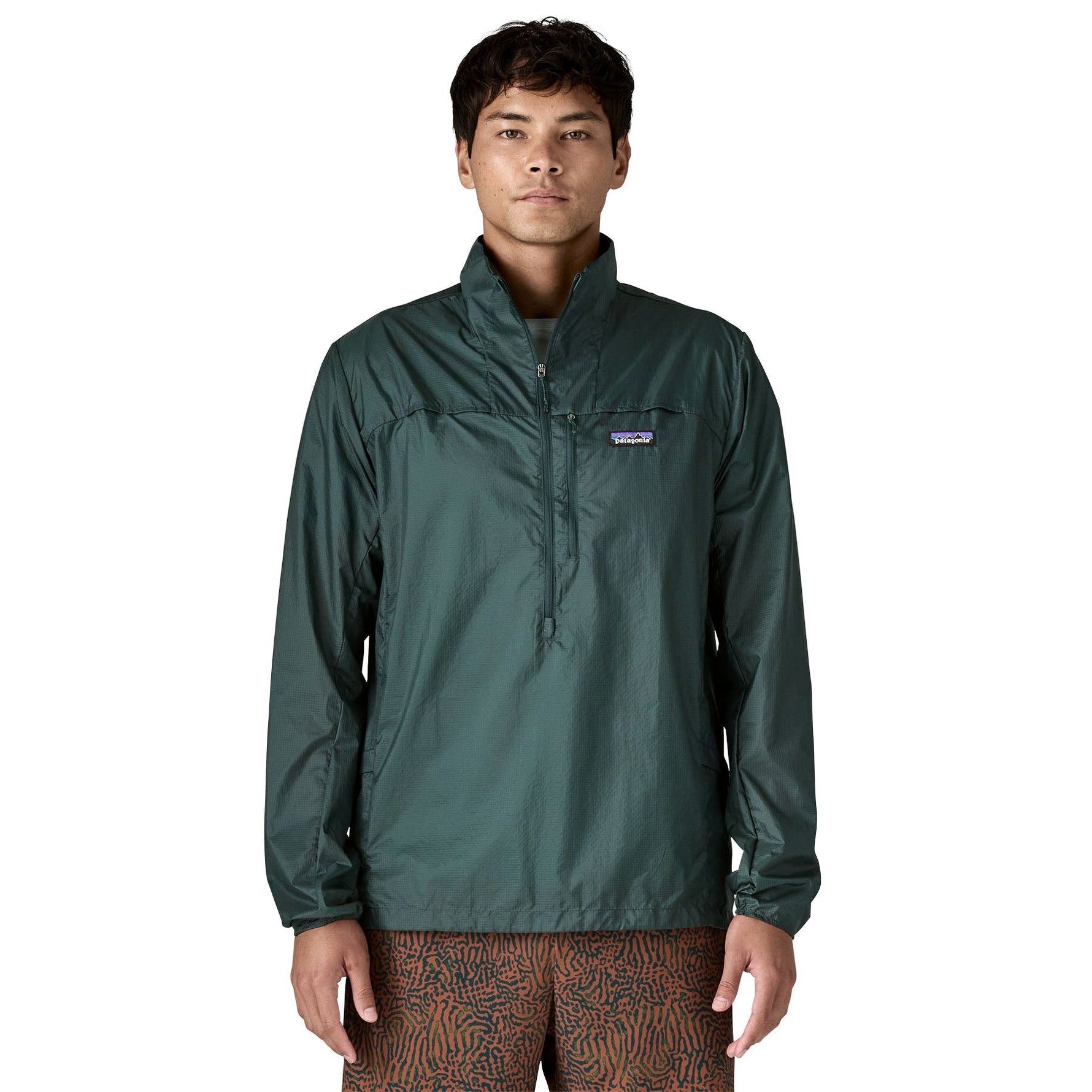 Man wearing Patagonia Houdini Stash half-zip pullover jacket in dark green