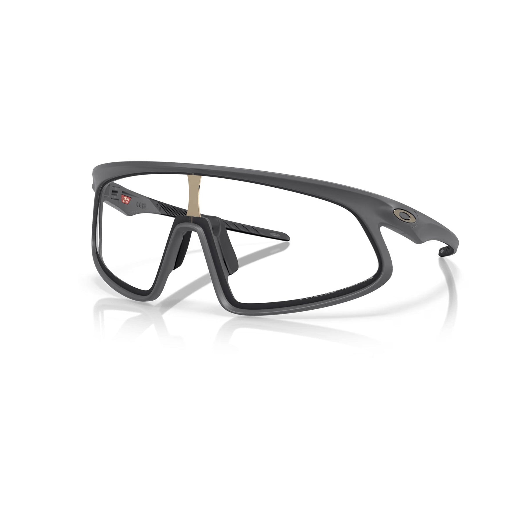 Oakley RSLV matte carbon sports sunglasses with clear photochromic lenses on white background