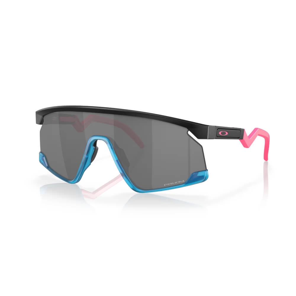 Oakley BXTR sunglasses with black frame, blue accents, pink temple tips, and dark lenses