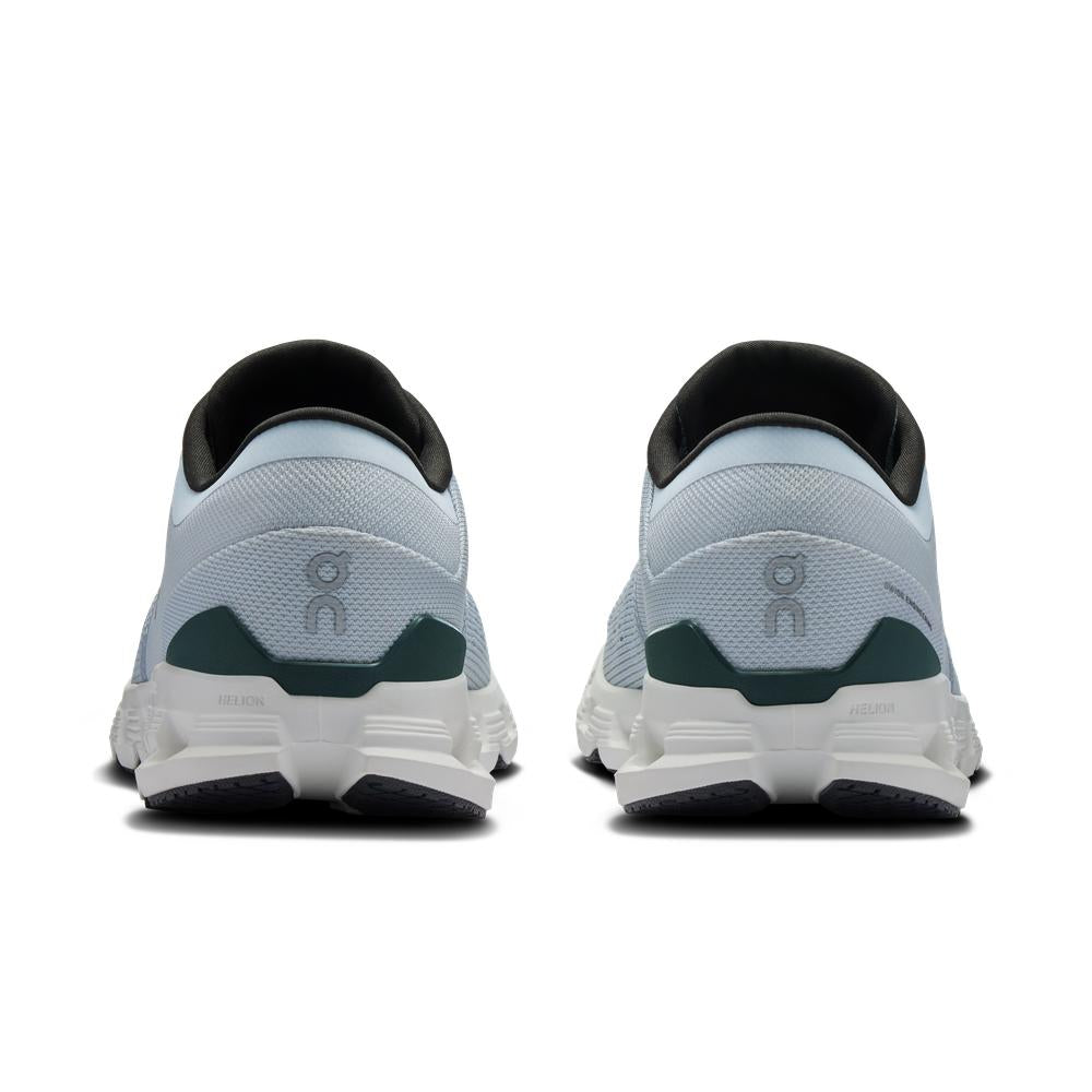 On Cloud X 4 men's running shoes in glacier blue with green accents, rear view