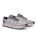 On Cloud X 4 running shoes in silver with flame orange accents on white background