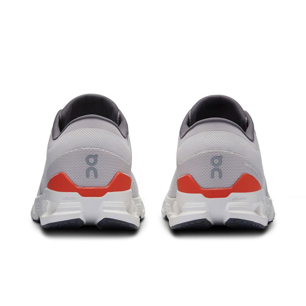 On Cloud X 4 running shoes in silver with orange flame accent, rear view
