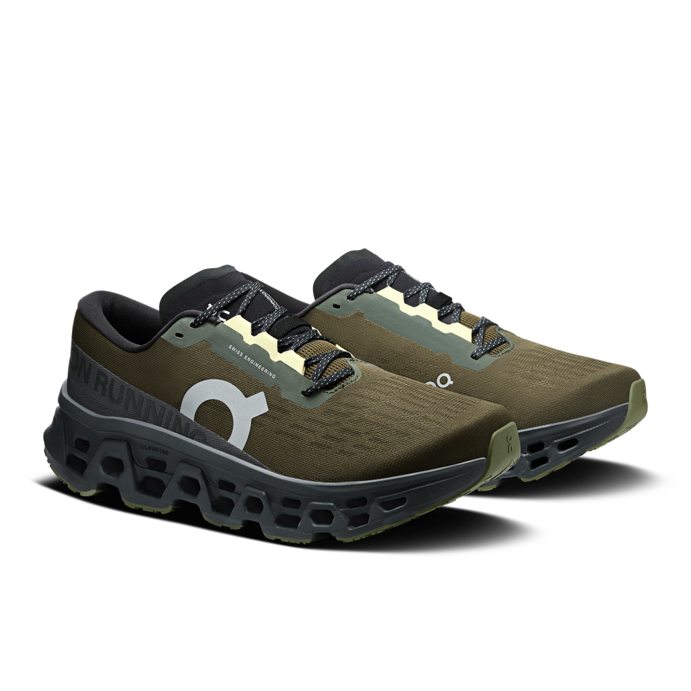 On Cloudmonster 3 running shoes in olive green and black colorway on white background