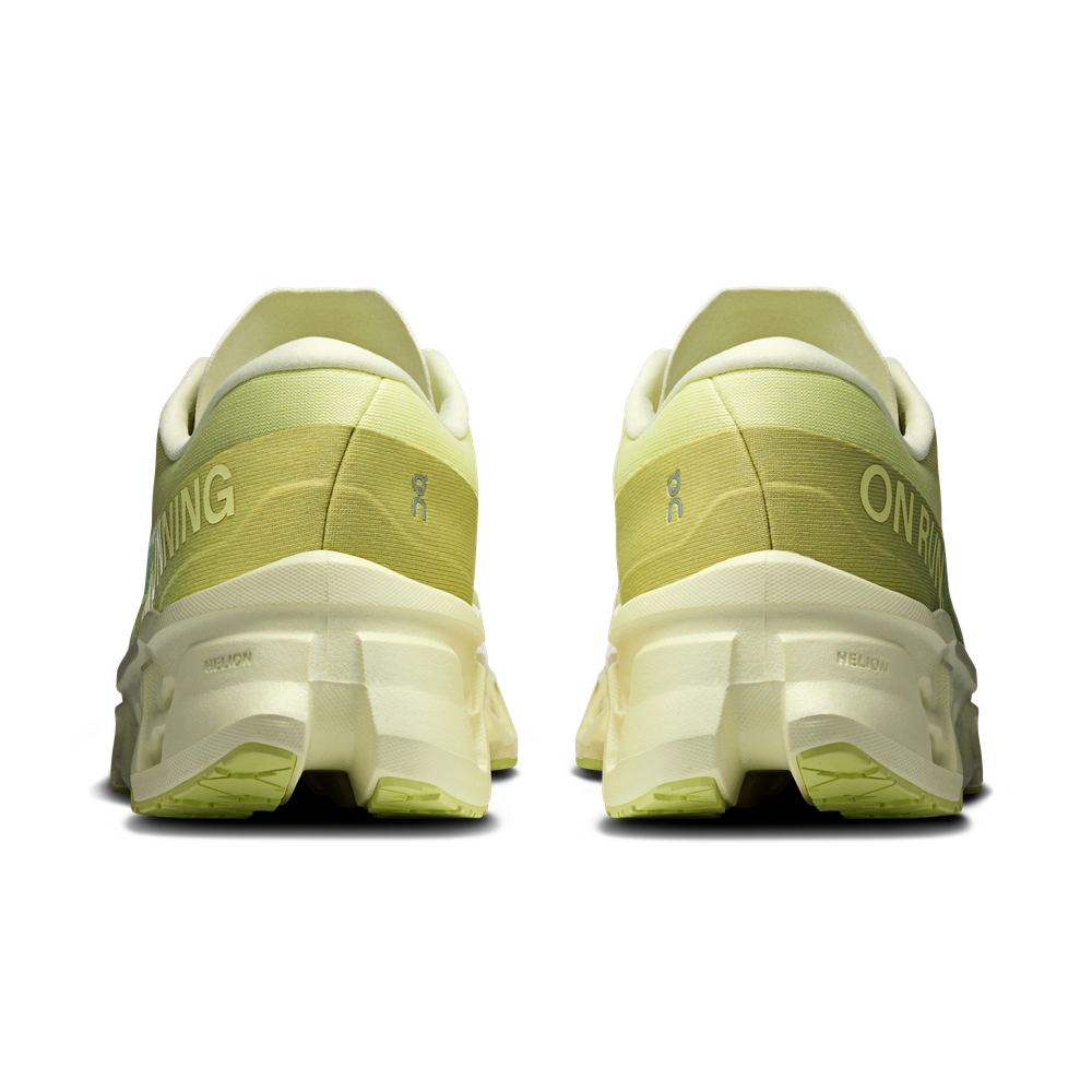 On Cloudmonster 3 running shoes in limelight green colorway, rear view showing heel design