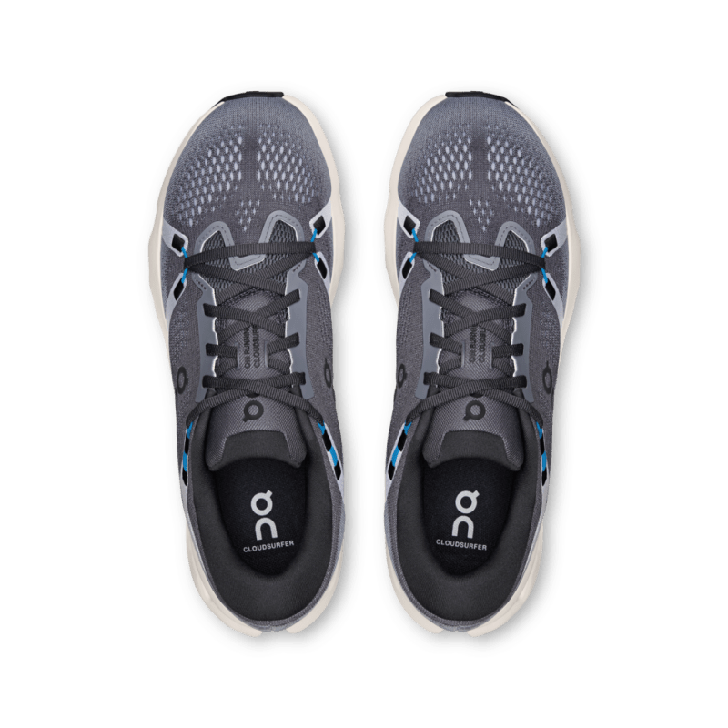 On Cloudsurfer running shoes in dark gray with blue accents, top view showing mesh upper
