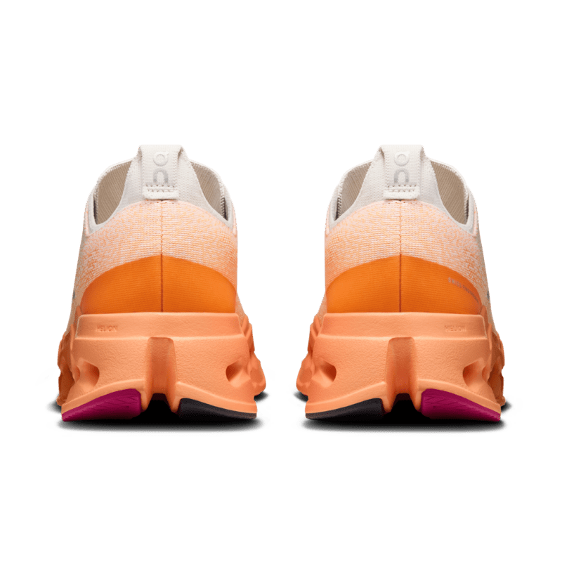 On Cloudsurfer Max men's running shoes in pearl and tangerine gradient colorway, rear view