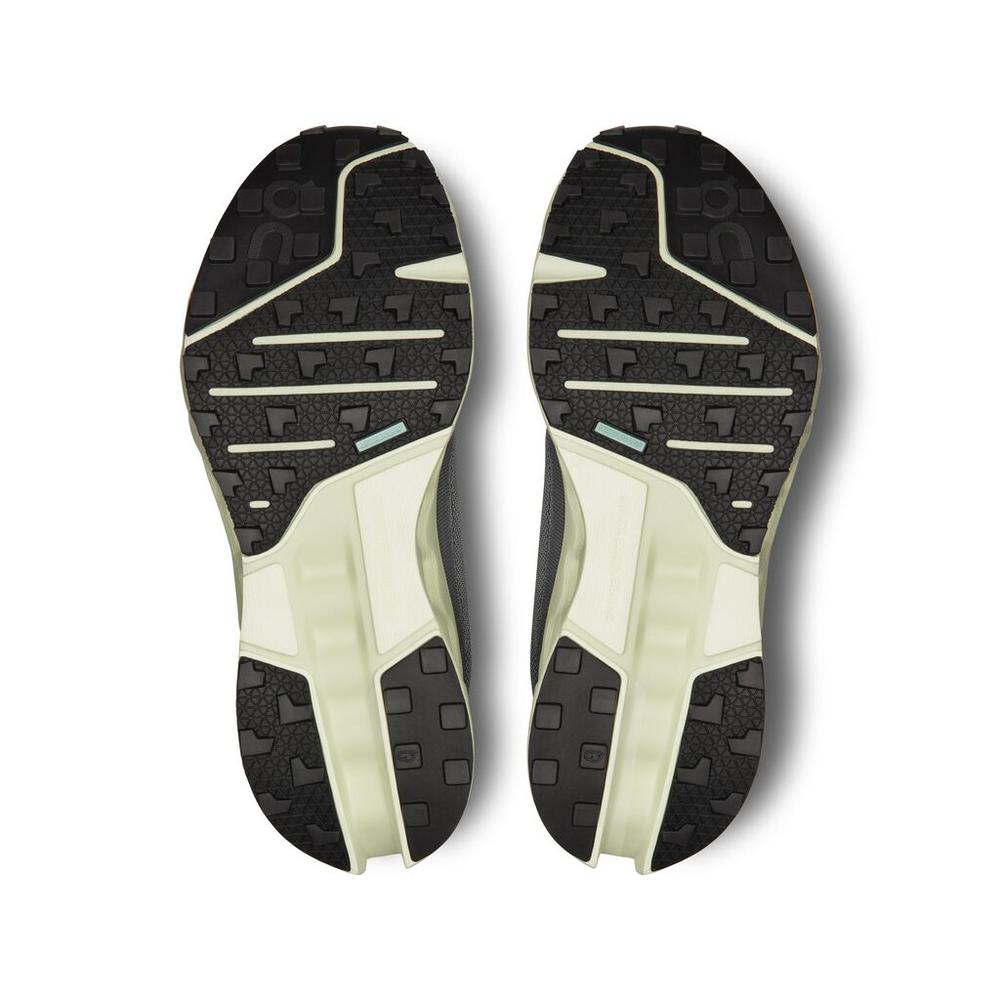 On Cloudsurfer trail running shoe soles showing black tread pattern with lime green midsole